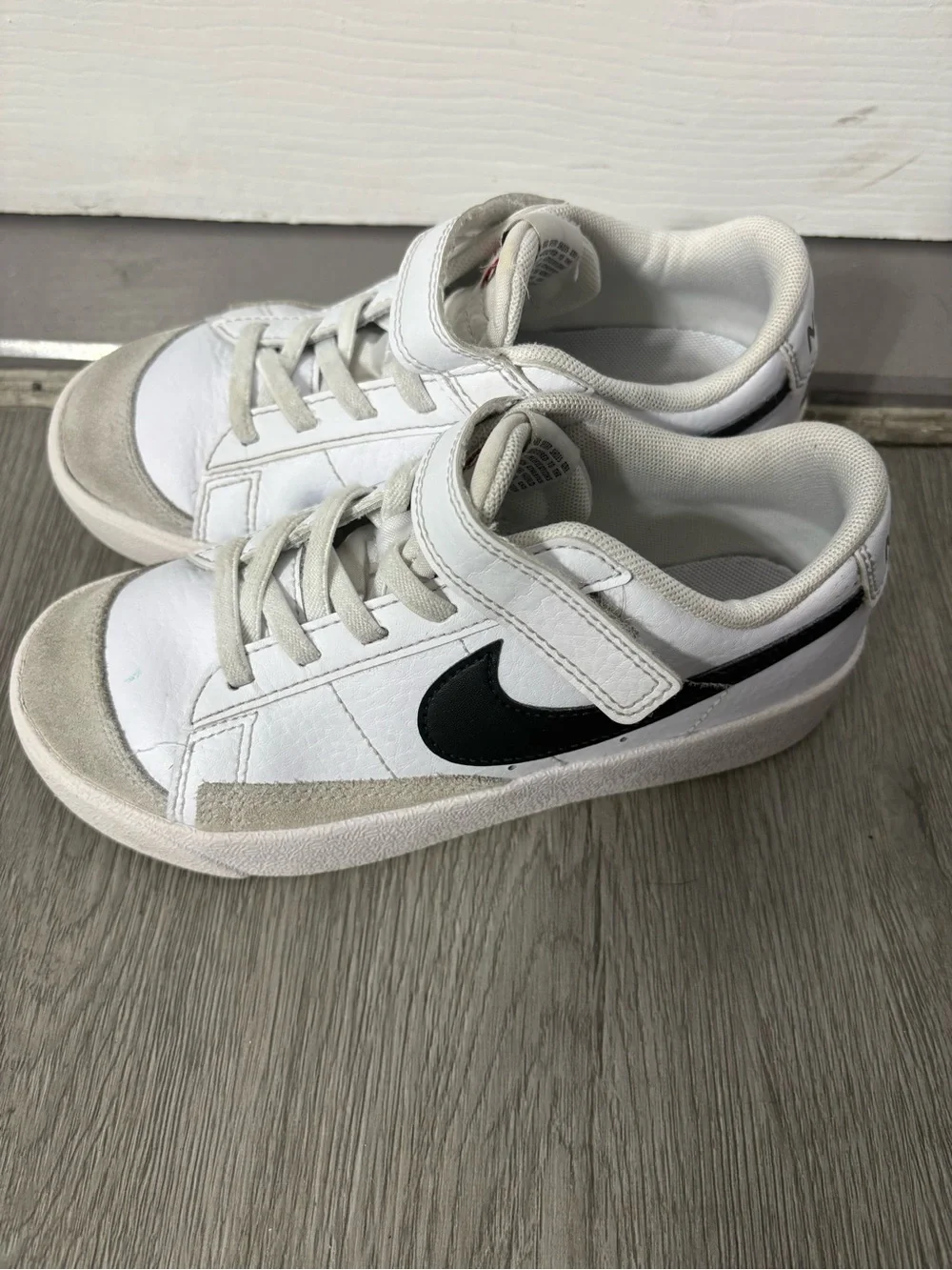 Nike Kids White Sneakers with Black Swoosh